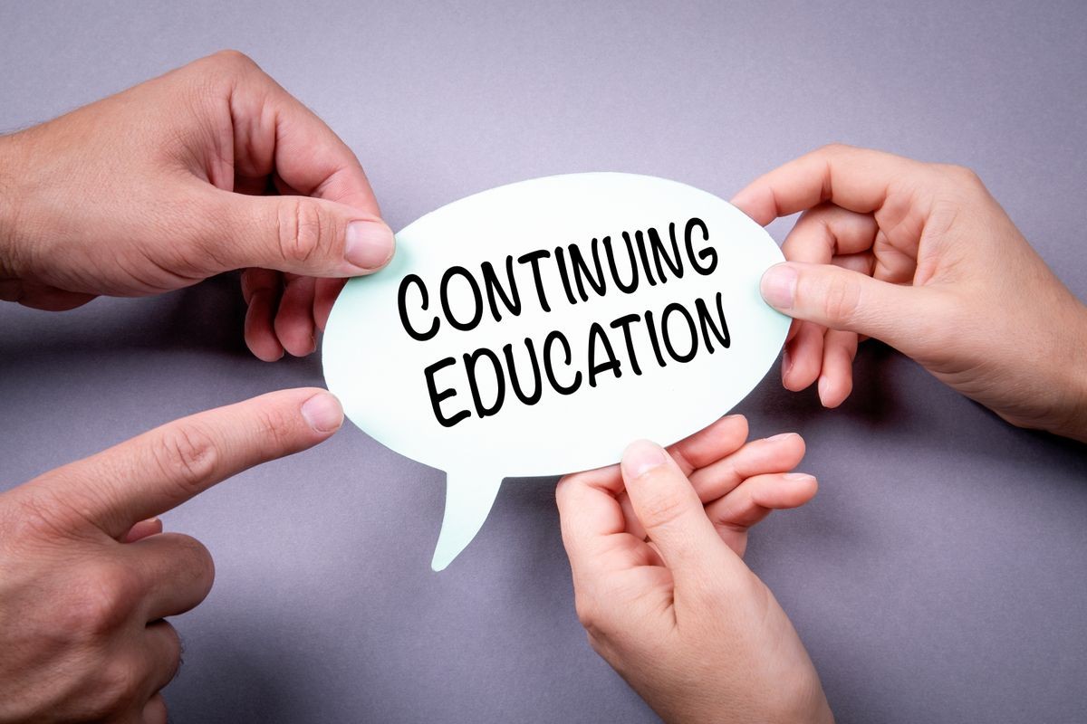 continuing education concept. Speech bubble on a gray background
